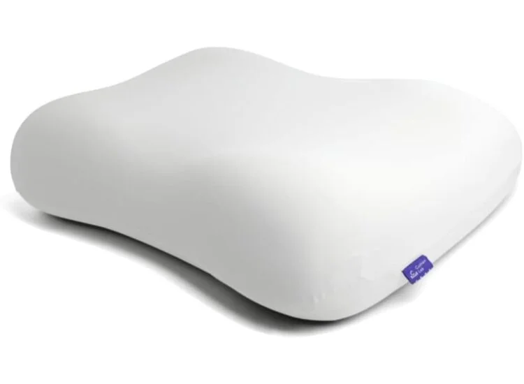 White contoured ergonomic pillow by Beckham Hotel Collection with purple tag, designed for cervical support.
