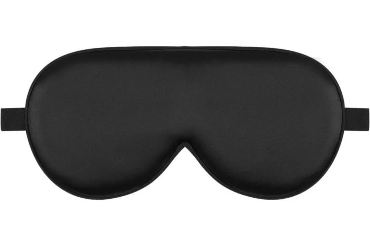 Black contoured sleep mask by Beckham Hotel Collection designed to block light and improve sleep quality.